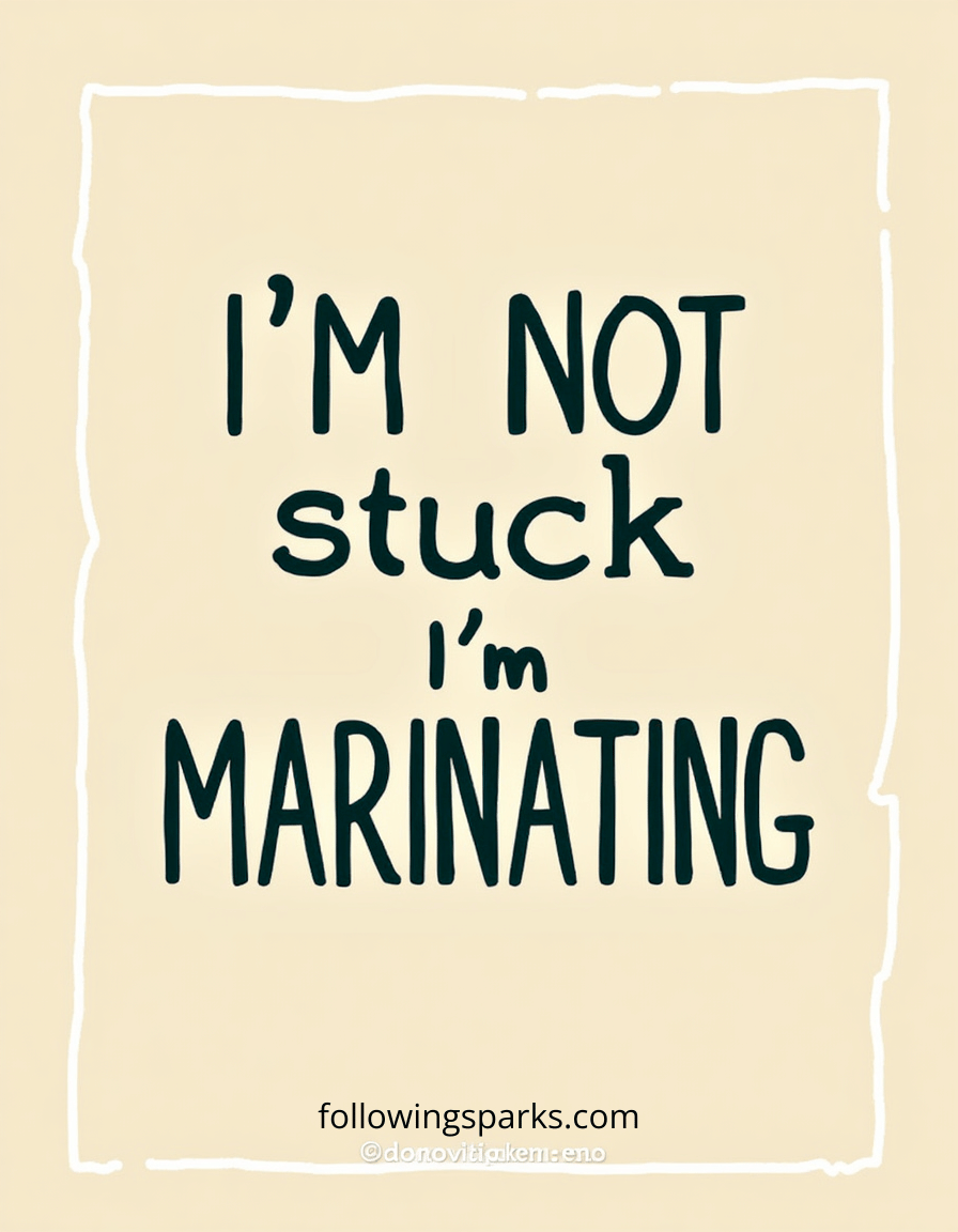 A humorous sign with the text "I'm not stuck, I'm marinating" on a beige background with white border lines, and a website and social media handle at the bottom.